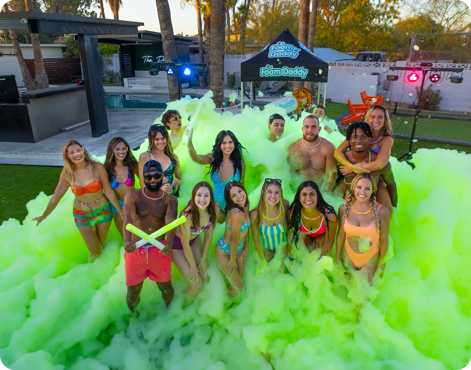 Friends having fun in green foam